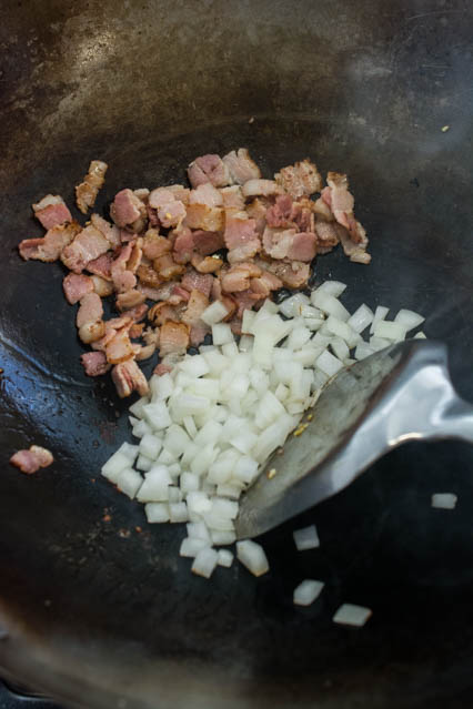 bacon and onion in a wok