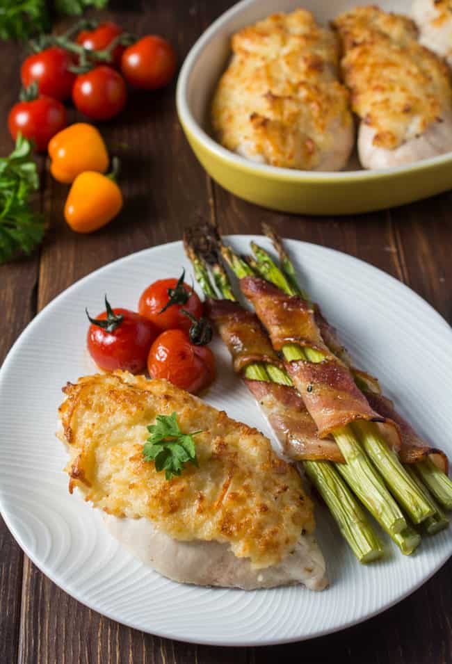 Parmesan Crusted Chicken is guaranteed to turn out super-moist and juicy every single time. Takes just minutes to prepare which makes it perfect for a family weeknight meal yet it is elegant enough for your next romantic evening in.