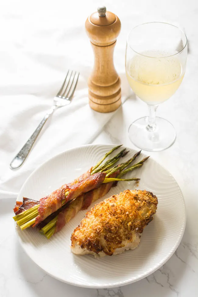 Parmesan Crusted Chicken is guaranteed to turn out super-moist and juicy every single time. Takes just minutes to prepare which makes it perfect for a family weeknight meal yet it is elegant enough for your next romantic evening in.