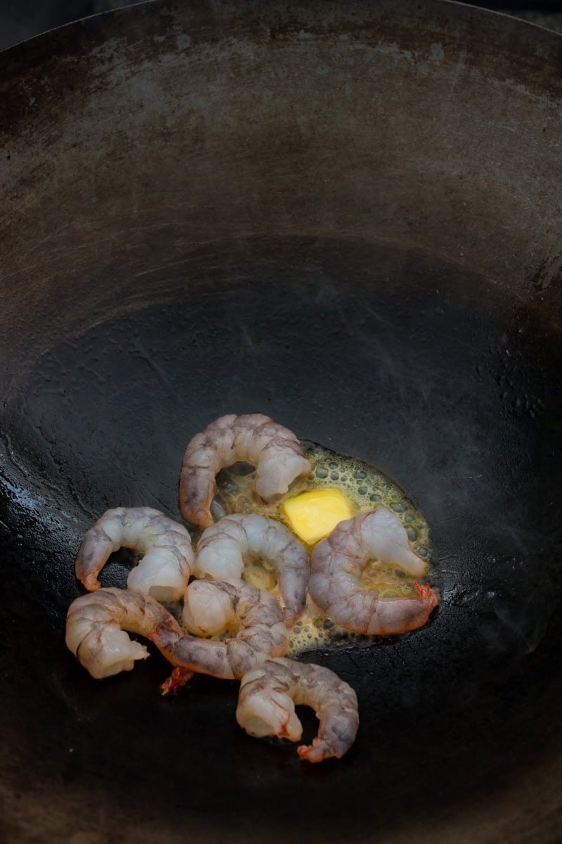 sizzling shrimp with butter in a wok