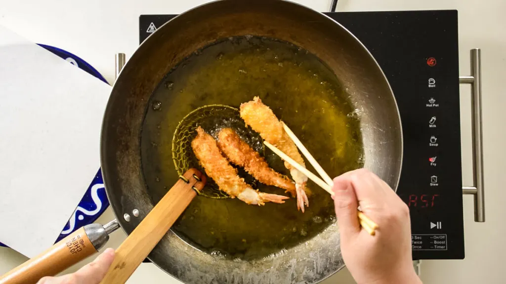 removing shrimp tempura from hot oil