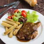 Chicken Chop with Black Pepper Sauce - Delicious grilled marinated chicken covered with a rich, bold black pepper sauce.