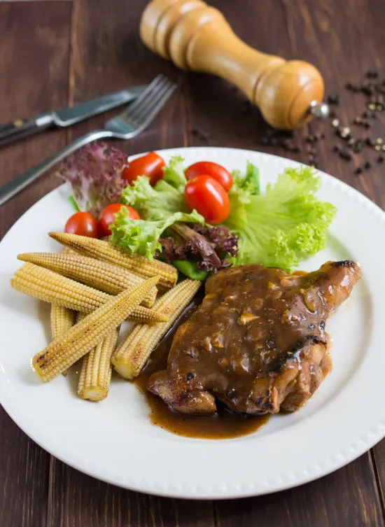 Chicken Chop with Black Pepper Sauce - Delicious grilled marinated chicken covered with a rich, bold black pepper sauce.