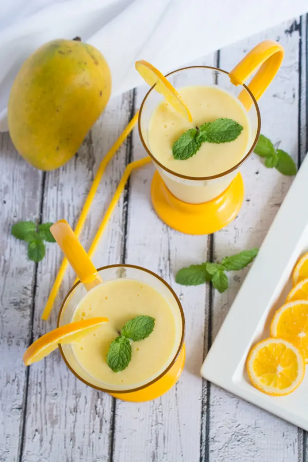Smooth, refreshing and delicious Mango and Orange Lassi. A smoothie you can enjoy during any season, and pairs exceptionally well with spicy dishes. 