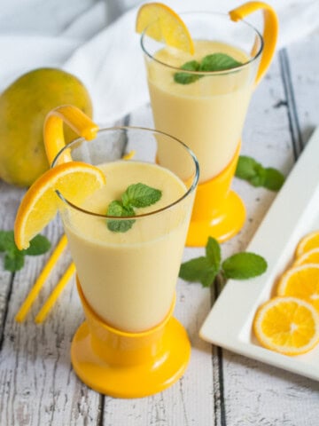 Smooth, refreshing and delicious Orange and Mango Lassi. A smoothie you can enjoy during any season, and pairs exceptionally well with spicy dishes.