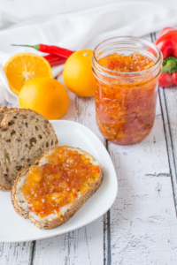 Orange and Pepper Jelly is a unique, tasty blend of orange marmalade with red pepper jelly. It's the best of both worlds. Add a habanero pepper for a spicy kick!