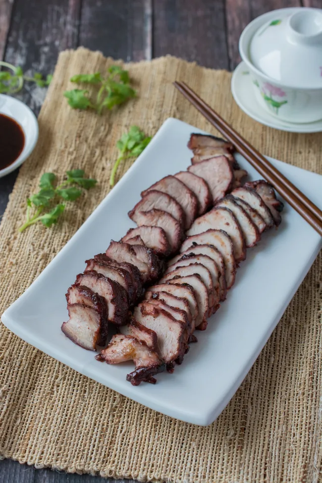 This Chinese BBQ Pork (Char Siu) recipe features a sweet, thick marinade that doubles as a dipping sauce. Now you can make this Chinatown favorite in your own kitchen! You won't believe how easy this recipe is!