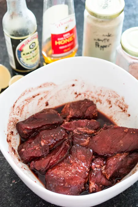 This Chinese BBQ Pork (Char Siu) recipe features a sweet, thick marinade that doubles as a dipping sauce. Now you can make this Chinatown favorite in your own kitchen! You won't believe how easy this recipe is! 