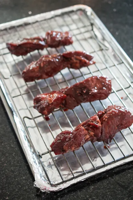 This Chinese BBQ Pork (Char Siu) recipe features a sweet, thick marinade that doubles as a dipping sauce. Now you can make this Chinatown favorite in your own kitchen! You won't believe how easy this recipe is!