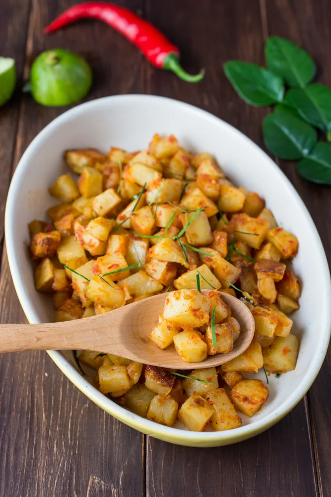 Spicy Fried Potatoes (Indonesian Sambal Goreng Kentang) is the Indonesian version of home fries. It's spicy, sweet and tangy. Serve as a side dish, or enjoy over steamed rice. 