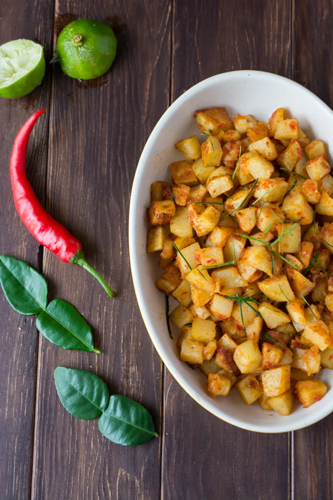 Spicy Fried Potatoes (Indonesian Sambal Goreng Kentang) is the Indonesian version of home fries. It's spicy, sweet and tangy. Serve as a side dish, or enjoy over steamed rice. 