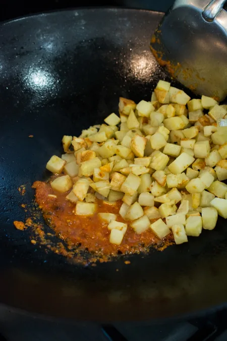 Spicy Fried Potatoes (Indonesian Sambal Goreng Kentang) is the Indonesian version of home fries. It's spicy, sweet and tangy. Serve as a side dish, or enjoy over steamed rice. 