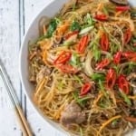 Japchae is a classic Korean noodle dish that can be served as a side dish, main dish, or over rice. Stir-fried glass noodles with sliced beef, julienned carrots, vegetables and mushrooms, tossed in a sweet soy sauce dressing.