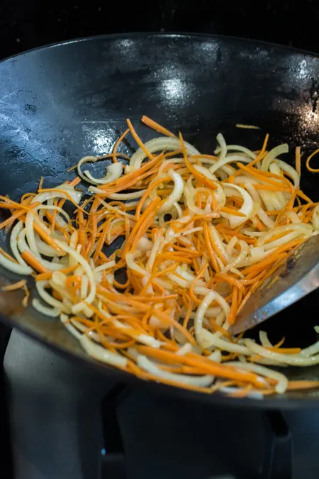 Japchae is a classic Korean noodle dish that can be served as a side dish, main dish, or over rice. Stir-fried glass noodles with sliced beef, julienned carrots, vegetables and mushrooms, tossed in a sweet soy sauce dressing.