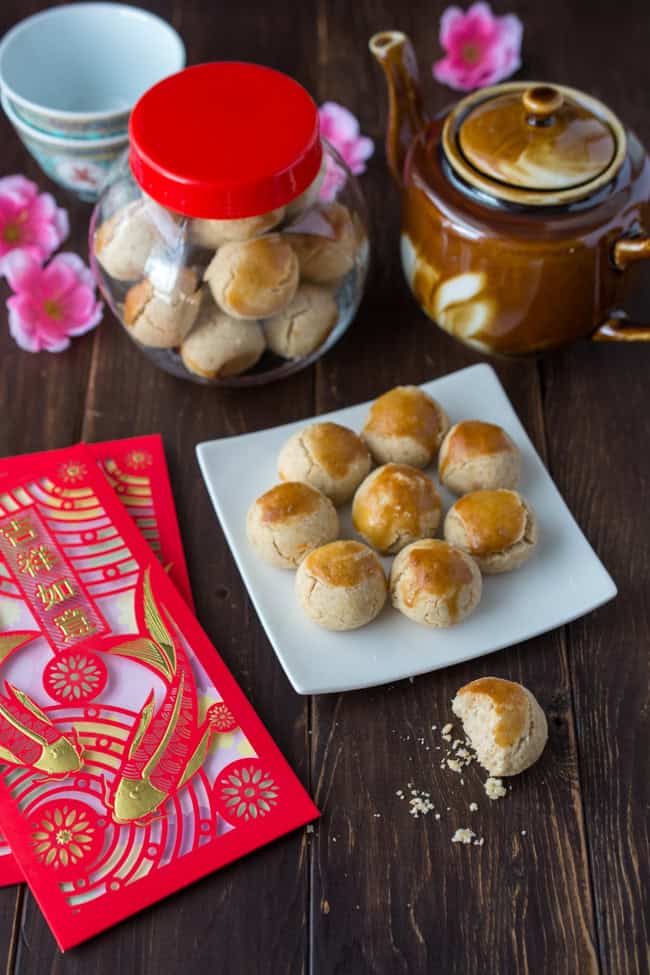 These traditional Chinese Peanut Cookies are sweet morsels of peanutty goodness that crumble and melt in your mouth. This popular Chinese New Year treat is so easy to make and irresistibly delicious.