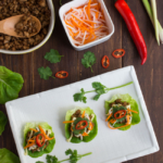 Inspired by Vietnamese Lemongrass Pork Bahn Mi Sandwiches, these Pork Bahn Mi Lettuce Wraps feature a lemongrass pork filling topped with creamy mayonnaise, pickled carrots and daikon, then topped with cilantro and fresh chili.