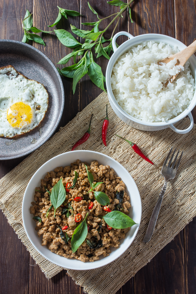 Thai Basil Chicken (Pad Krapow Gai or Gai Pad Krapow) is a classic Thai stir-fry where the amazing aroma of basil pairs so well with the savory sauce. Serve over steamed jasmine rice and top with a fried egg for the ultimate Thai comfort food; all ready in less than 20 minutes!