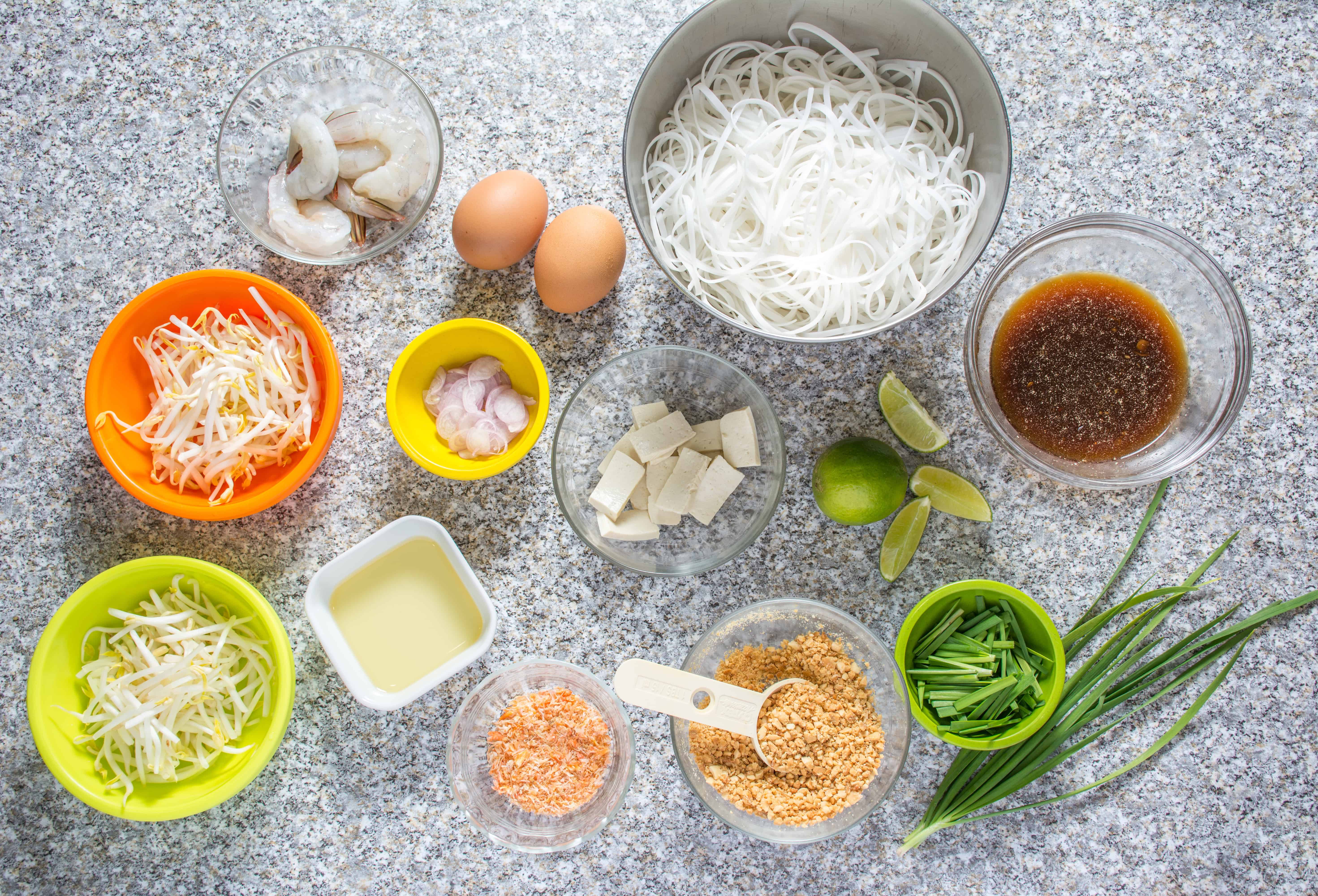 Authentic Pad Thai made easy! Rice noodles stir-fried in a slightly sweet and tangy sauce, topped with shrimp, sliced tofu, ground roasted peanuts, and fresh bean sprouts.