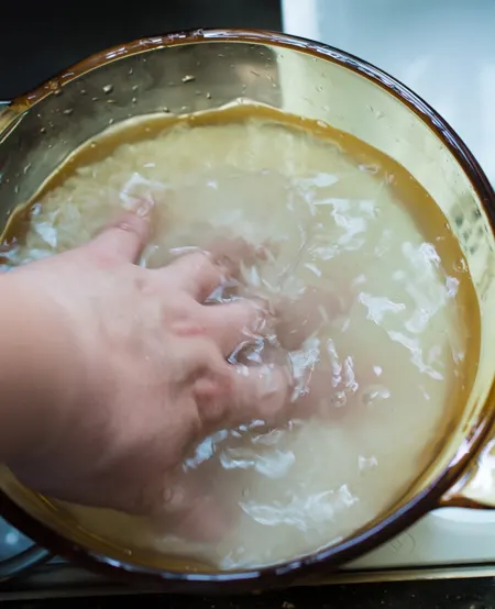 Washing rice in a pot