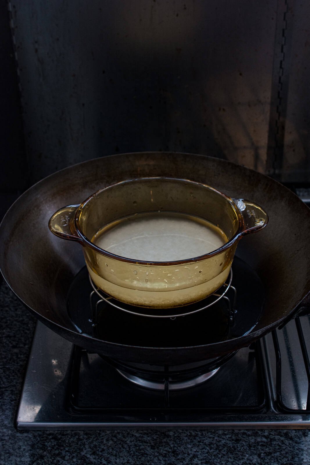 setup for steaming rice in a wok