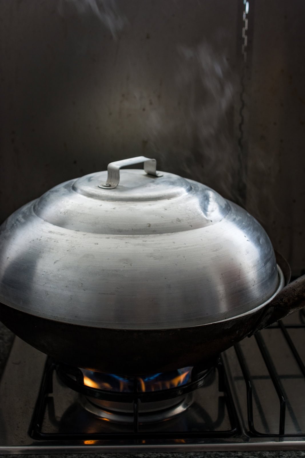 steaming rice in a wok