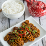 Stir Fried Lotus Root in Garlic Sauce features sliced crunchy lotus root tossed in a tangy garlic sauce. Healthy, nutritious, and incredibly delicious. Ready in only about 15 minutes!