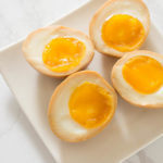 Half-Boiled Ajitama (Seasoned Ramen Eggs) have slightly firm egg whites and luscious custard-like yolks. The sweet soy seasoning gives them unbelievable flavor. Famously used as a topping for ramen but can be enjoyed as a snack anytime.