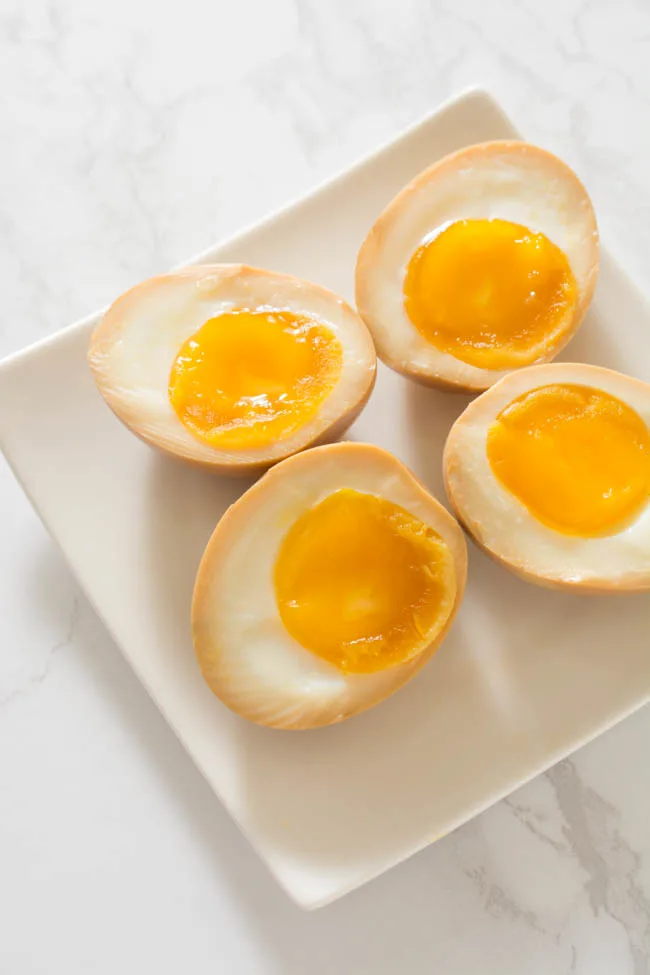 Half-Boiled Ajitama (Seasoned Ramen Eggs) have slightly firm egg whites and luscious custard-like yolks. The sweet soy seasoning gives them unbelievable flavor. Famously used as a topping for ramen but can be enjoyed as a snack anytime.
