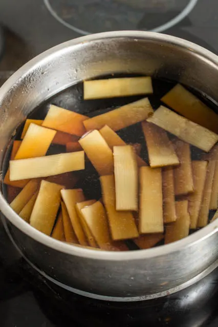 Menma (Seasoned Bamboo Shoots) is a classic Japanese ramen topping but can also be enjoyed as a snack. Slightly crunchy and extremely flavorful. 