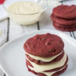 These Red Velvet Chocolate Chip Cookies are awesome enough on their own, but add the Cream Cheese Frosting and it takes the cookie to a whole new level of YUM!