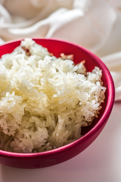 baked white rice in a red bowl