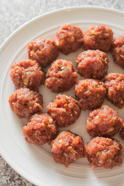 Chinese BBQ Pork (Char Siu) meatballs uncooked on white plate