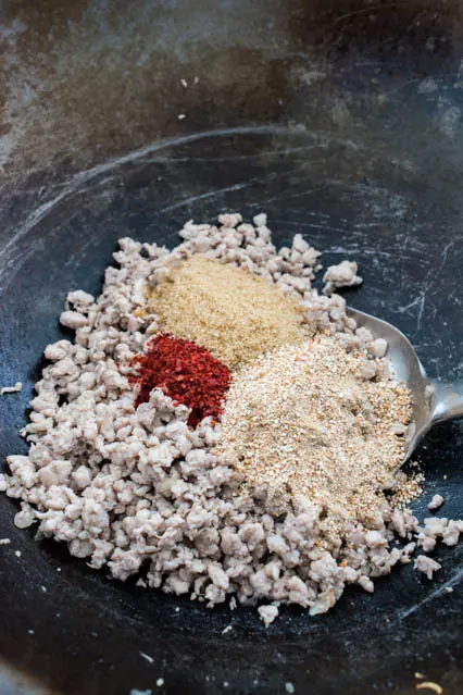 Pork Thai Larb ingredients in wok