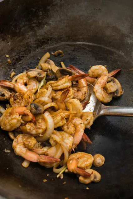 stir fried tom yum shrimp in wok