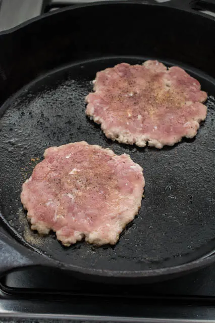 pork patties in a skillet