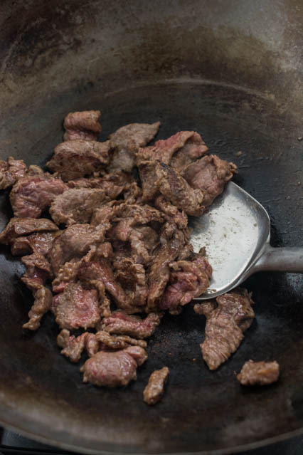 stir frying strips of beef