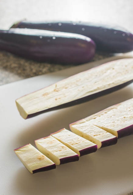 sliced eggplant on white cutting board