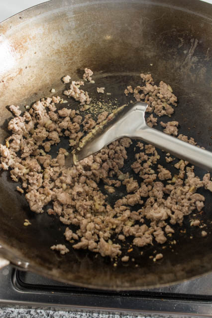 stir fried ground pork in a wok