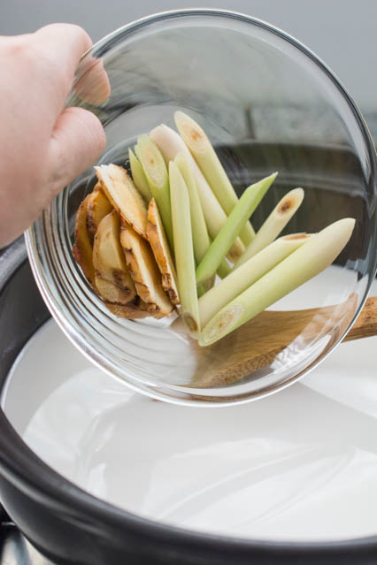 sliced galangal and lemongrass for tom kha gai soup