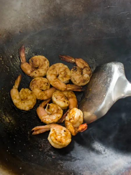 stir fried shrimp in a wok