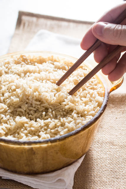 fluffing brown rice with chopsticks