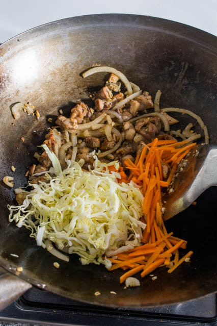 cabbage, carrot and chicken in wok for pad woon sen