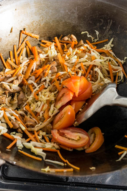stir fried vegetables in wok for pad woon sen