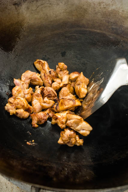 stir frying chicken for pad see ew