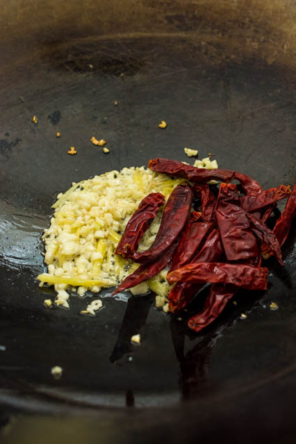 ginger, garlic and dried red chili in a wok