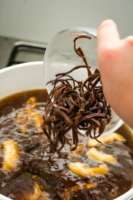 adding wood ear mushroom to hot and sour soup