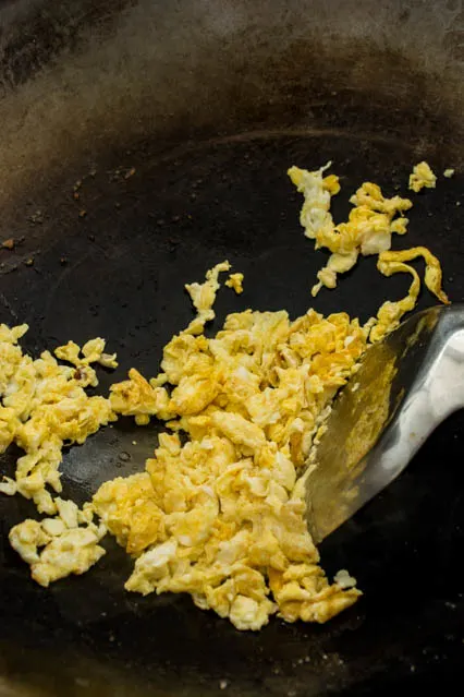 scrambled eggs in wok for shrimp fried rice