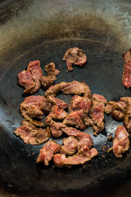 beef strips in a wok