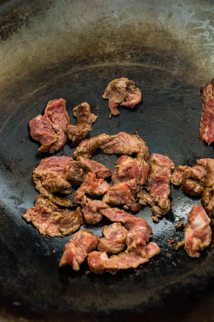 beef strips in a wok