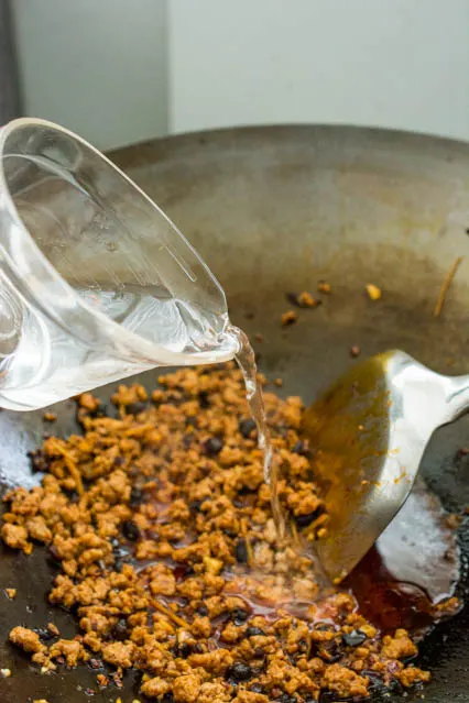 pouring water to mapo tofu sauce